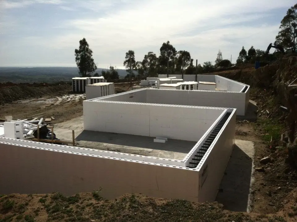 ICF foundation walls on a graded site with distant hills