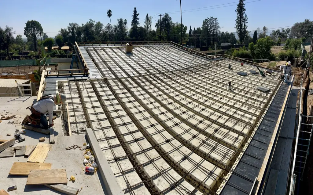 Reinforcing steel grid laid across an Insuldeck concrete roof deck before the pour