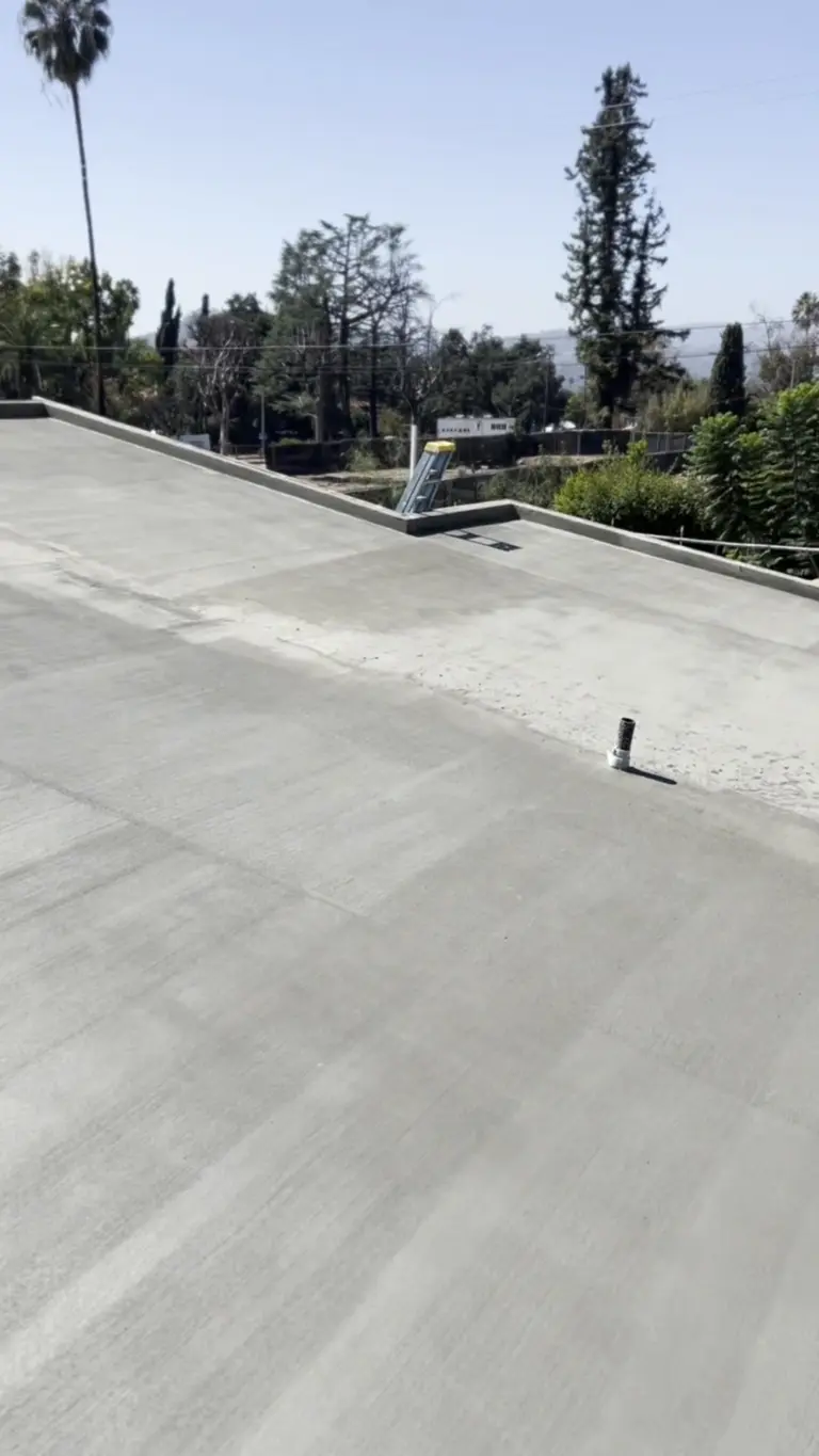 Finished concrete roof deck surface