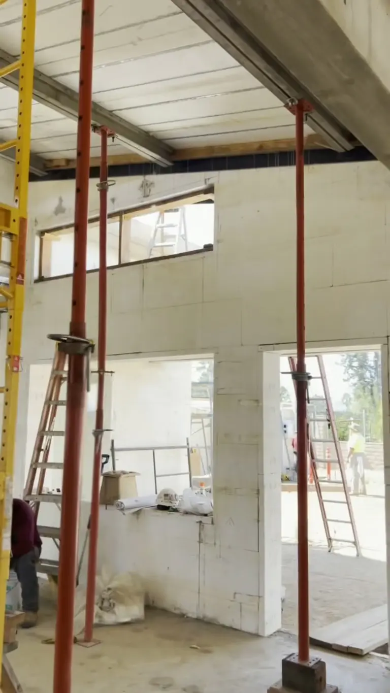 Interior ICF walls with temporary shoring below a concrete deck